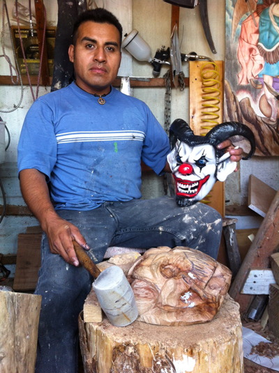 Master artist Luiz Morales Ortiz with a mask he made, to be worn during the danza de los diablos (dance of the devils) of the Mixteco region of Oaxaca, Mexico.  (Photo Amalia Martinez Carrasco)