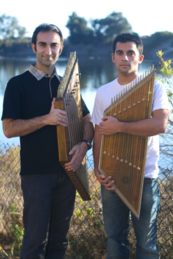 Master artist Bahram Osqueezadeh (left) and apprentice Areo Saffarzadeh with their santurs.