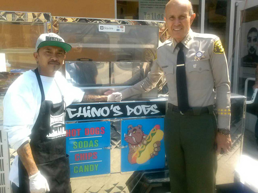 Hoang Pham (left) in front of Chino's Dogs with Sheriff Lee Baca.