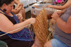 Holly Hensher, Pimm Tripp-Allen and Tyithreeha Allen making a maple bark skirt which is used by women in all ceremonies and traditionally in everyday life. Photo courtesy the artist.