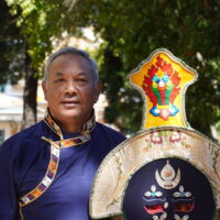 Opera Master Sonam Phuntsok, with a Ngonpa mask (stage purification dance mask). Photo by Tenzin Thinley