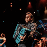 Pepe Carlos playing the accordion. Photo courtesy of artist's Instagram