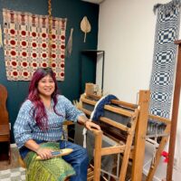 Jamie Pesquiza Cardenas
In their weaving studio in Sacramento, CA aka Unceded Nisenan Territory.
Photo by Hazel Pinon.