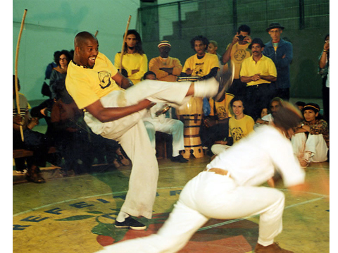 Members of ICAF-Oakland perform capoeira.