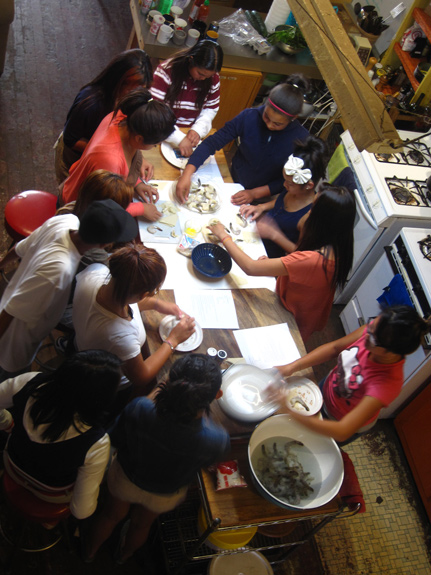 During sessions of Banteay Srei’s SAUCE, program participants aged 14-19 are taught traditional food preparation by grandmothers, mothers, and other matriarchal community elders.