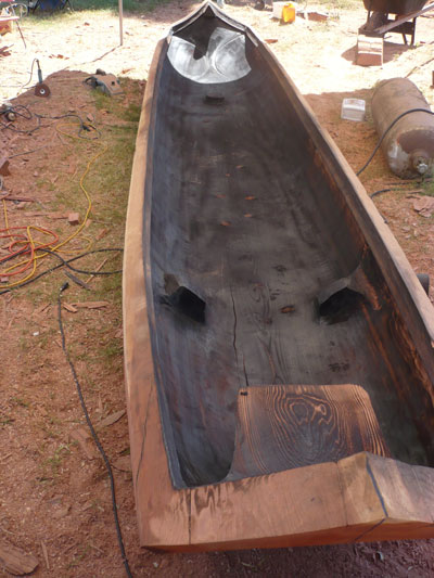 A traditional Yurok redwood dugout canoe, constructed by master artist George Blake and his apprentices Sagep Jake Blake and Caw-Tep Wolf Lee Sylvia.
