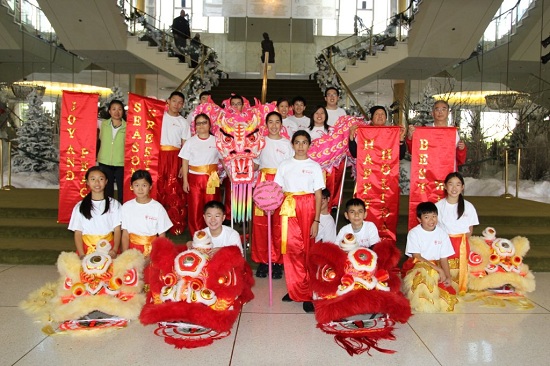 JC Culture Foundation Youth Lion Dance Group pose for a photo after performing at an Los Angeles holiday show in December 2012.