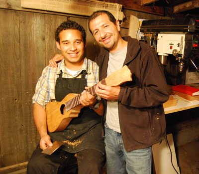 Apprentice Juan Francisco Parroquin (left) and master artist Jorge Mijangos with Parroquin's first guitarra de son in-progress in Mijangos' workshop.