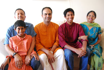 Left to right: Gridhar Athreya (Kiran’s father) holding Kishan Ahtreya (Kiran’s brother), master artist Parasuraman SunderRajan, apprentice Kiran Athreya, and Mallika Athreya (Kiran’s mother).
