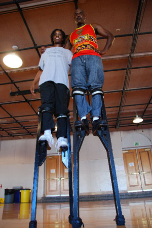 Apprentice Latanya Tigner (left) with her 2009 master artist Shaka Zulu.  Latanya was taught the history and purpose of Mukudji, or West African stilt dancing, and the role of the Nyon Kwuyo, or stilt dancer.